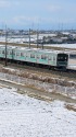 雪景色の宇都宮線を行く205系