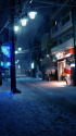 雪の降る街を