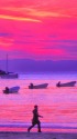 夕焼けの海岸を走る